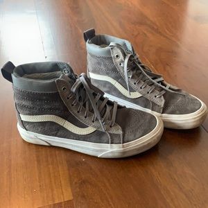 Grey and white high top vans